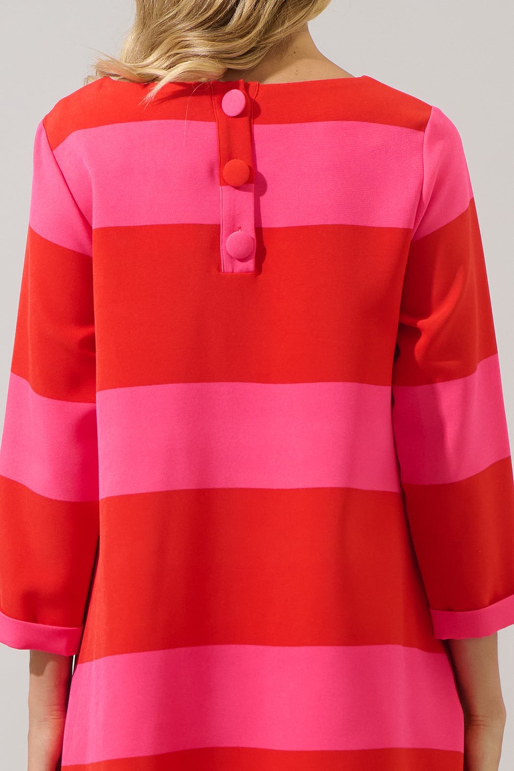 Close-up of candy cane stripe button detail on back