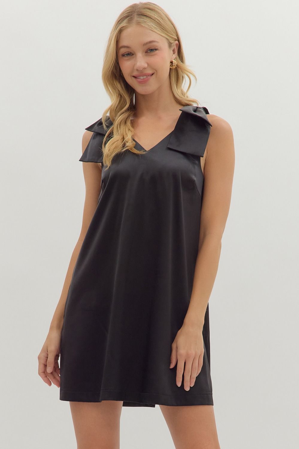 Front view of black satin mini dress with bow shoulder details