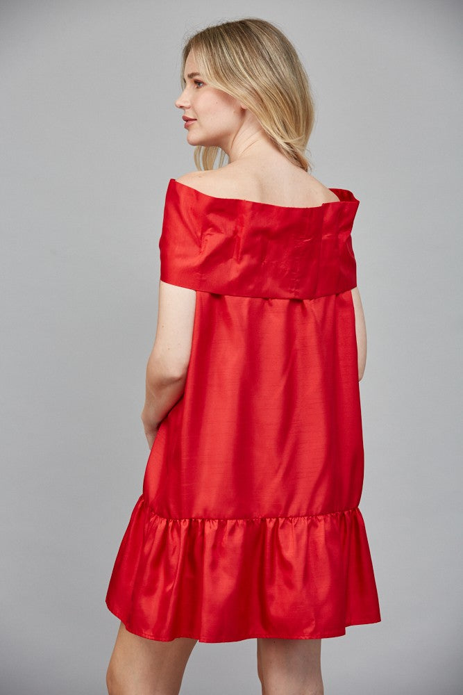 Back view of red satin dress with off-shoulder neckline and flowy fit