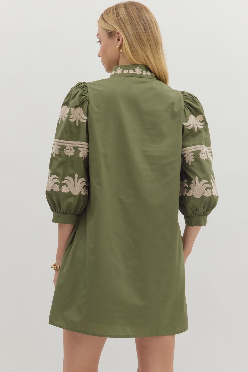 Back view of olive green puff sleeve dress with intricate embroidery — chic boho-inspired boutique dress.