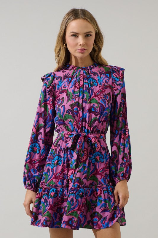 Model wearing a pink floral mini dress with long sleeves, ruffle hem, and belted waist — a vibrant statement dress from Milo & Lily Boutique perfect for fall events or brunch days.
