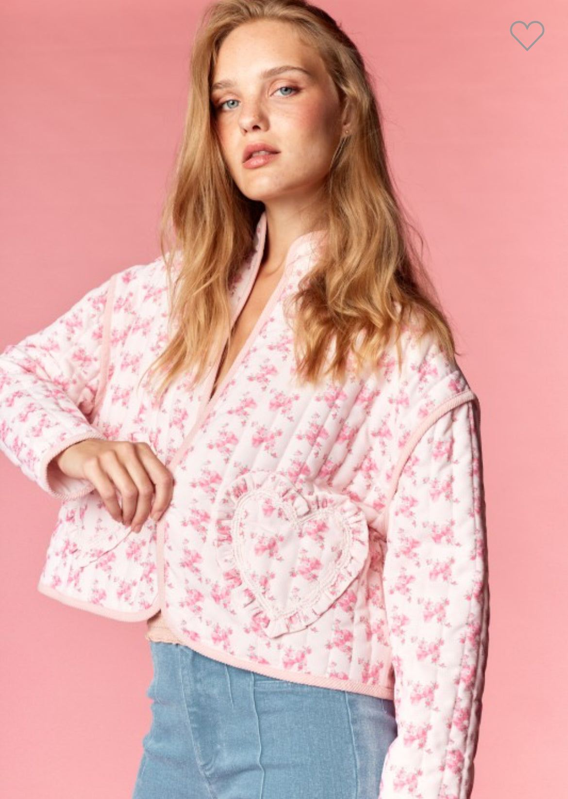 Close-up of pink floral quilted heart pocket jacket with ruffle trim details — whimsical boutique statement piece.