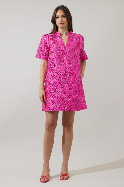 Full body image of model wearing The Pink Posh Mini styled with pink heels — a bright fuchsia embroidered mini dress from Milo & Lily Boutique