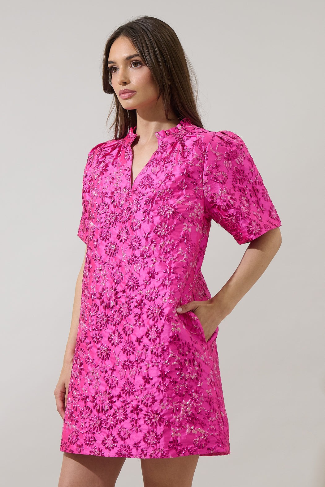 Side angle of The Pink Posh Mini highlighting the textured floral shimmer and flattering A-line fit.