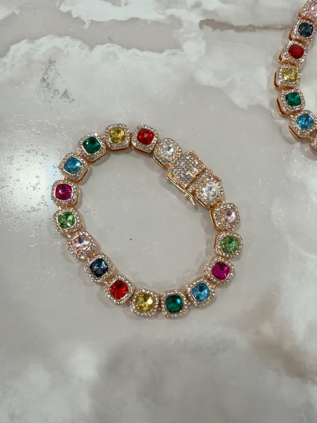 Rainbow Radiance bracelet detail showing multicolored stones and gold-tone clasp