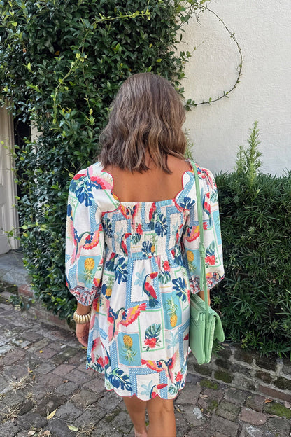 back view tropical toucan print mini dress with smocked back and puff sleeves boutique summer dress