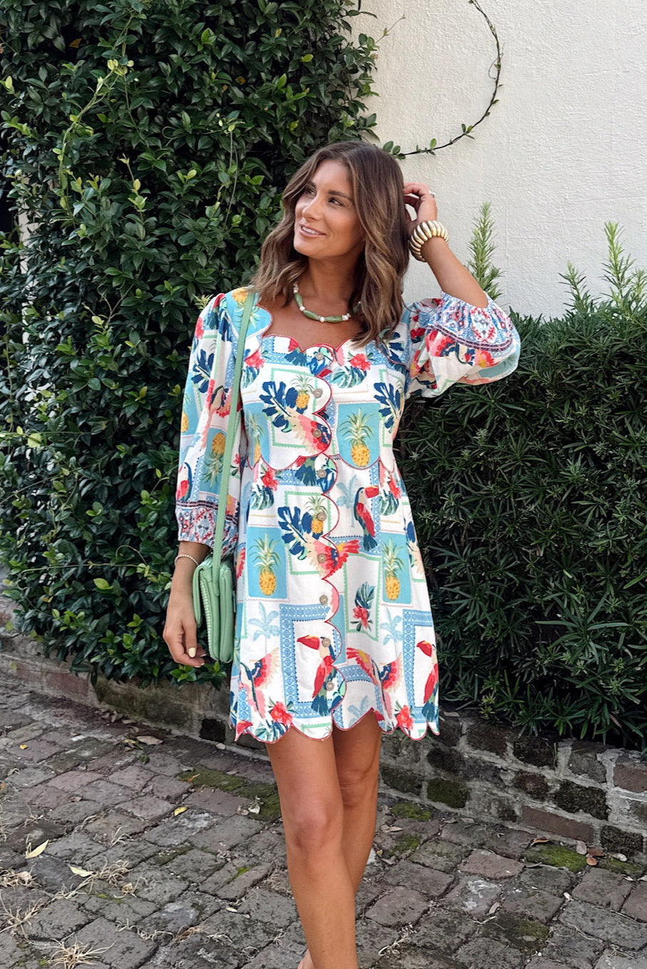 tropical toucan scallop mini dress with puff sleeves colorful parrot pineapple print boutique dress front view