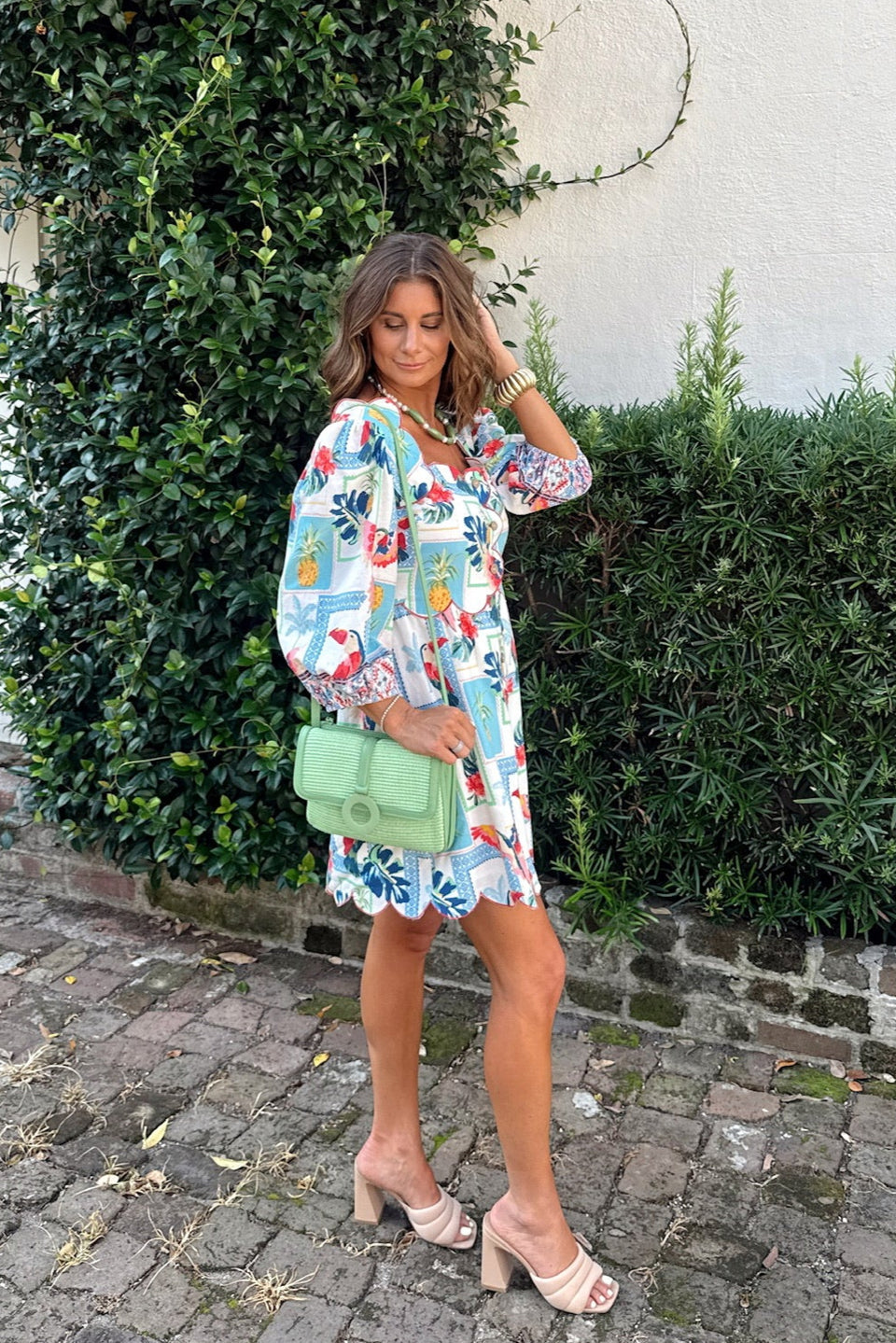 scalloped neckline tropical print mini dress with toucan and pineapple pattern close up detail