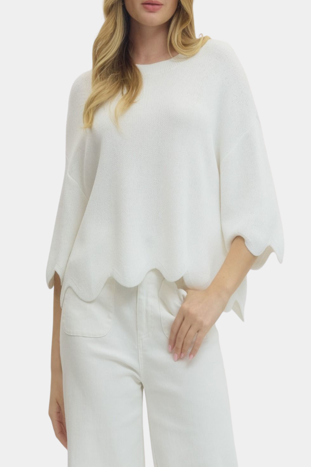 White knit top with scalloped hem and relaxed fit, lightweight women’s sweater